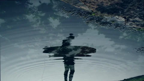 Surfer's reflection in the clear water Stock Footage 279000065