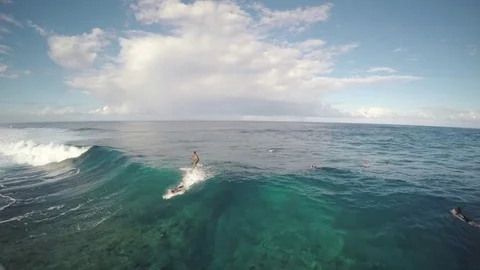 Surfers Ride Large Wave On Cloudy Beach Day 2 Stock Footage 79735199