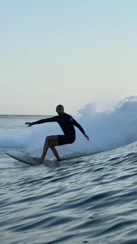 Surfers rides a powerful ocean wave.Vertical video Stock Footage 300746337