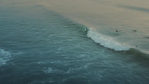 Surfers riding blue ocean waves. Stock Footage 285734589