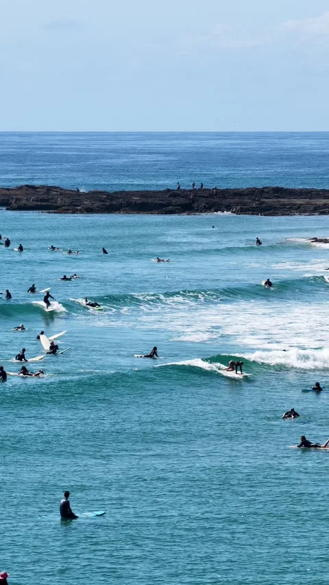 Surfers Riding Waves At Snapper Rocks, Queensland Australia - Vertical Stockbeeldmateriaal 347104918
