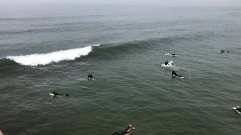 Surfers on small waves Stock Footage 112365426