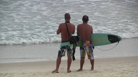 Surfers Standing on Beach Stock Footage 53413406