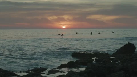 Surfers At Sunset - Cinematic 4K Stock Footage 273498969