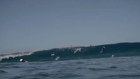 Surfers surfing in the big rolling waves in sea in slow motion Stock Footage 108644702