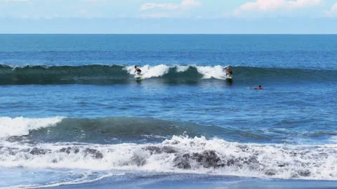 Surfers surfing big waves super slow motion Stock Footage 100089273