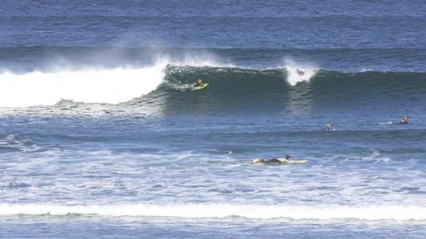 Surfers surfing on ocean waves Stock Footage 85813318