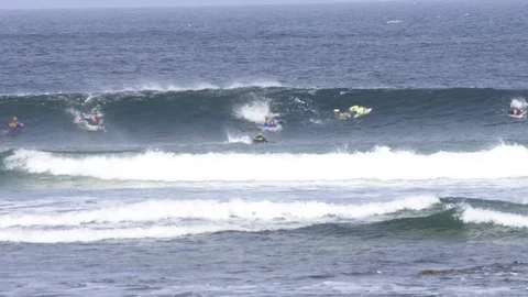 Surfers surfing on ocean waves Stock Footage 85813341