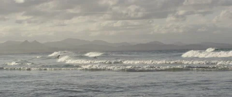 Surfers surfing in sea Stock Footage 67032404