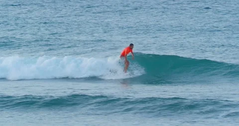 Surfers Surfing Small Waves on Atlantic Ocean in Dominica Republic at Sunset. Stock Footage 243398533