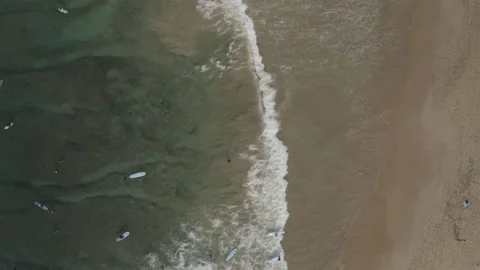 Surfers top down beach waves drone Sri Lanka Stock Footage 236944925