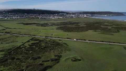 Surfers van driving towards the ocean on a single road Devon UK Stock Footage 254025354
