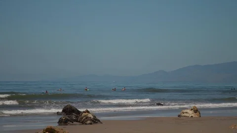 Surfers Wait for Perfect Wave | 4K Slow Motion Stock Footage 114392772