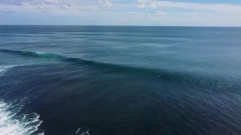 Surfers waiting on line-up for a wave Stock Footage 154228452