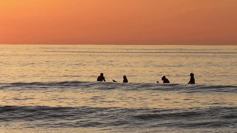 Surfers waiting for the next wave at Unstad Beach, the surfers paradise in Stock Footage 80682977