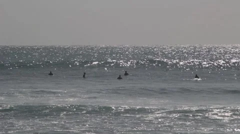 Surfers Waiting For Waves in the Ocean Stock Footage 67530973