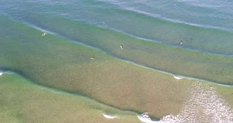 Surfers waiting for waves top down view the concept of patience and sport 스톡 동영상 326427182