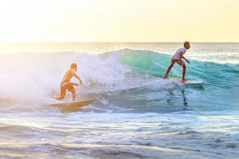 Surfers on the  waves Stock Photos