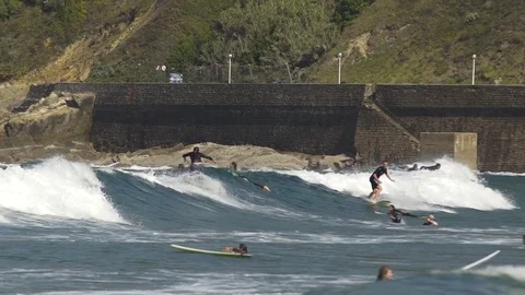 Surfers on waves slow-mo Stock Footage 72126322