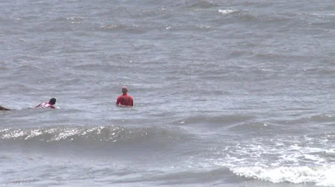 Surfers, zoomed Stock Footage 24456054
