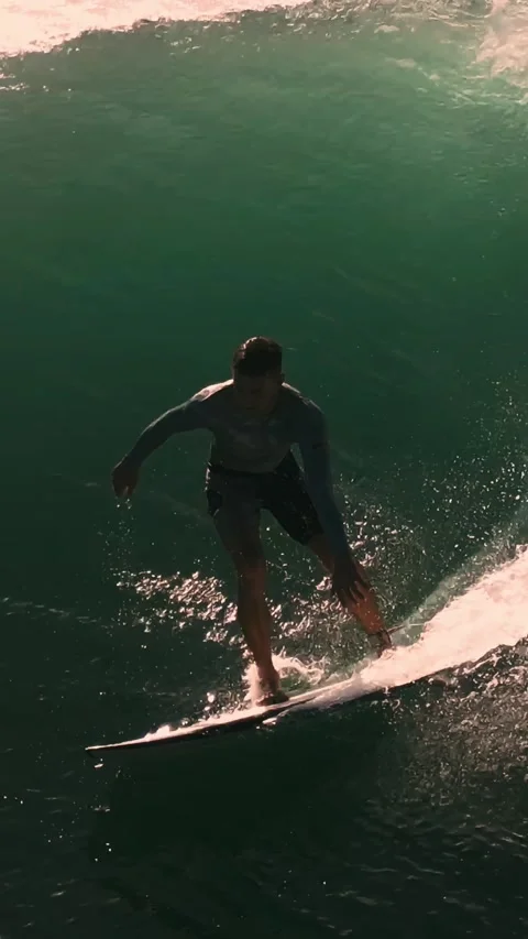 Surfing Bali Waves, Drone Captures Surfer On Bali Wave In Slow Motion Video stock 334686277