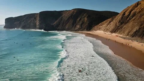 Surfing beach drone, dramatic cliff coastline, ocean wave surfers Stock Footage 309167480