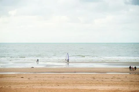 Surfing on the beach Stock Photos