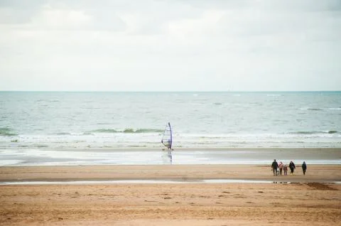 Surfing on the beach Stock Photos