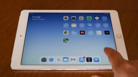 Surfing between desktop screens on Apple Ipad Stock Footage 114328054