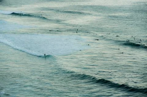 Surfing from a cliff at dusk Stock Photos
