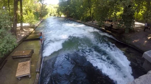 Surfing the Eisbach River in Munich, Germany Stock Footage 95388844