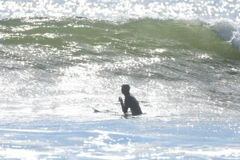 Surfing at First Beach Stock Photos