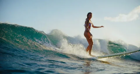 Surfing in Hawaii at Sunset Stock Footage 202097428