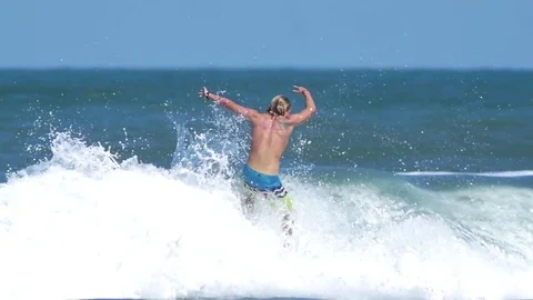 Surfing man Stock Footage 74586506