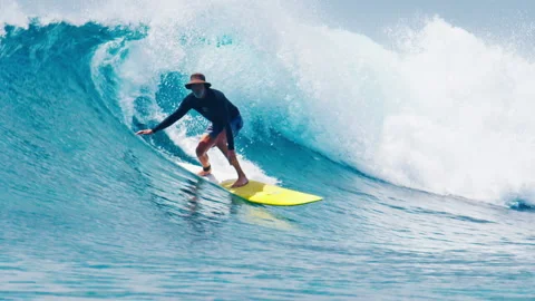 Surfing pack. Man surfs the wave in the Maldives. Four clips of the senior Stock Footage 221959134