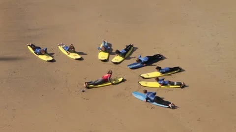 Surfing school instructor giving surf lesson Stock Footage