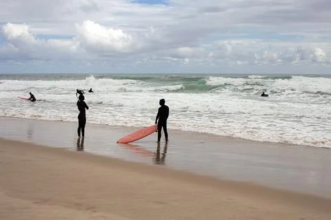 Surfing session on a rough sea Stock Photos