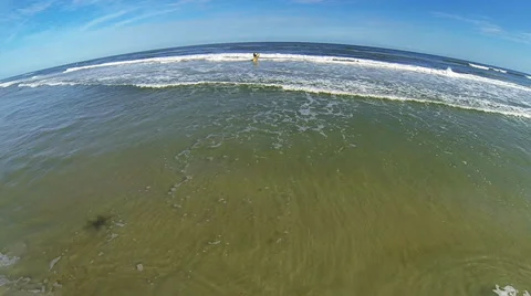 Surfing in St. Augustine FL - 16 Surfers on waves Aerial Stock Footage 34542321