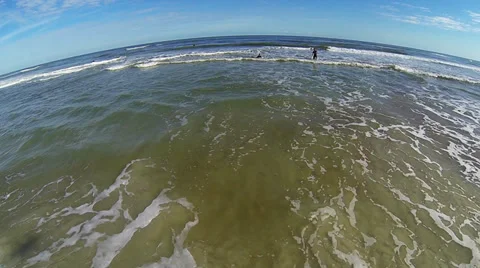 Surfing in St. Augustine FL hover over water Aerial Stock Footage 34542439