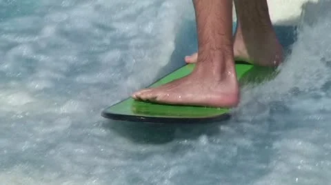 Surfing a Standing Wave: Flowrider Close Up Feet Stock Footage 11290257