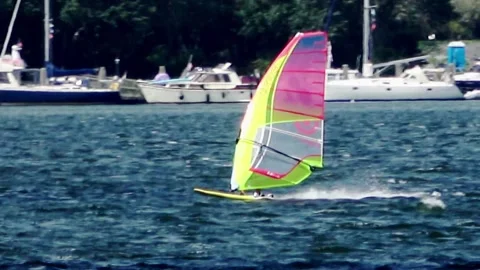 Surfing with strong wind on blue water Video stock 252180199