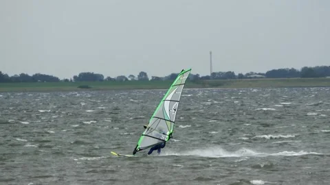 Surfing in strong wind on the Grevelingen Stock Footage 291797236