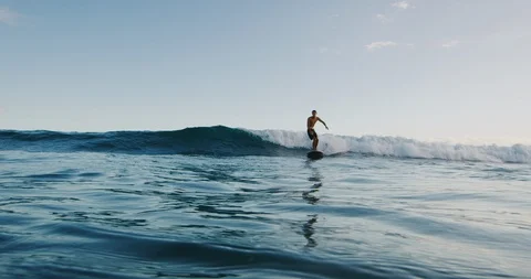 Surfing at sunset Stock Footage 109518582