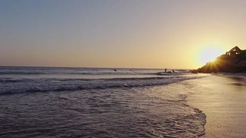 Surfing at sunset Stock Footage 246303724