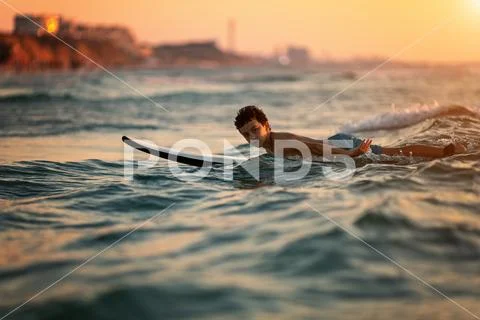 Surfing at Sunset. Outdoor Active Lifestyle Stock Photos