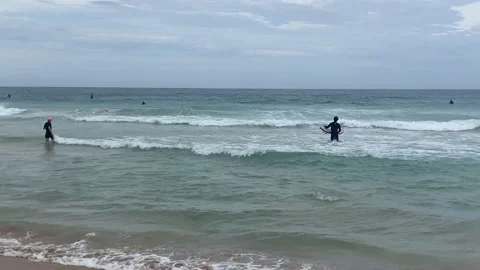 Surfing at Sydney Bondi Beach on a cloudy day Stock Footage 219664949