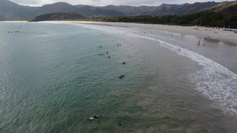 Surfing Symphony: Low-Flying Drone Journey over Selong Belanak Beach Stock Footage 259559827