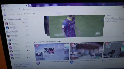 Surfing Twitch website scrolling in browser on laptop Stock Footage 128633116