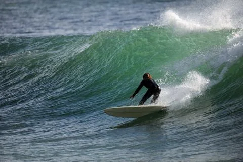 Surfing a wave - beach scenery 写真素材