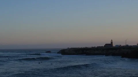 Surfing wave with lighthouse in background Stock Footage 85918277